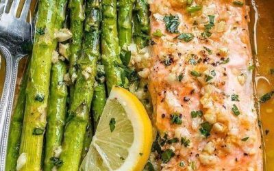 Baked salmon in foil with asparagus and lemon garlic butter sauce